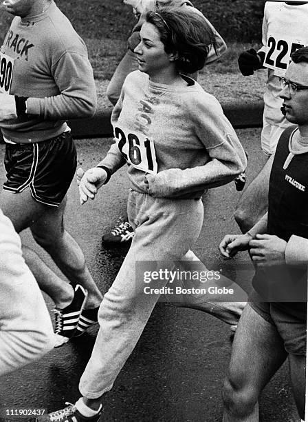 Kathy Switzer of Syracuse and Rocky Chamberlain directly behind during the Boston Marathon.