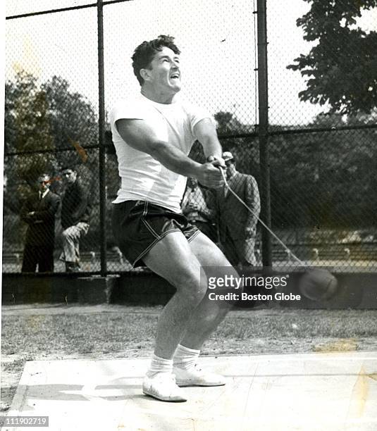 Harold Connolly, hammer thrower formerly of boston college, practices July 3, 1960