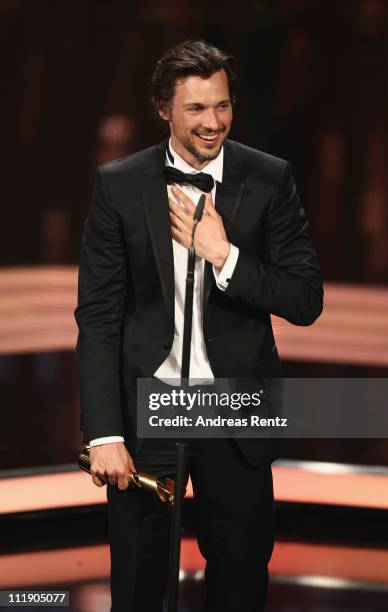 Florian David Fitz receives the Lola for Best Actor during the German Film Award 2011 at Friedrichstadtpalast on April 8, 2011 in Berlin, Germany.