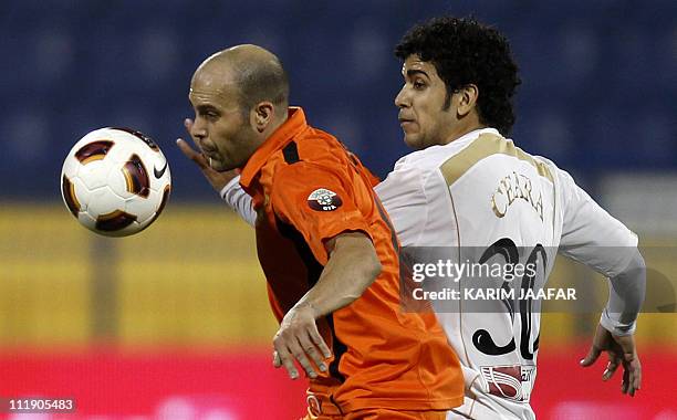 Lekhwiya's Brazilian defender Luiz challenges Umm Salal's Spanish midfielder Gabri Garcia during their Qatari championship final football in Doha on...