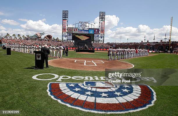 Players from the San Francisco Giants and the St. Louis Cardinals line up on the field before the start of the Giants' opening day game at AT&T Park...