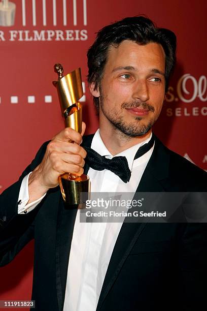 Actor Florian David Fitz poses with his award during the 'Lola - German Film Award 2011' at Friedrichstadtpalast on April 8, 2011 in Berlin, Germany.