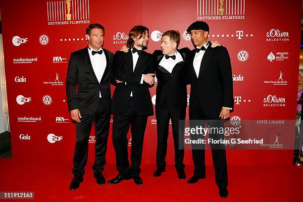Rat Pack Rea Garvey, Sasha, Michael Mittermeier and Xavier Naidoo poses infront of the winners board during the 'Lola - German Film Award 2011' at...