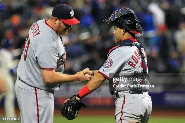 Closing pitcher Todd Coffey and catcher Ivan Rodriguez of the Washington Nationals celebrate after they won 6-2 against the New York Mets during the...