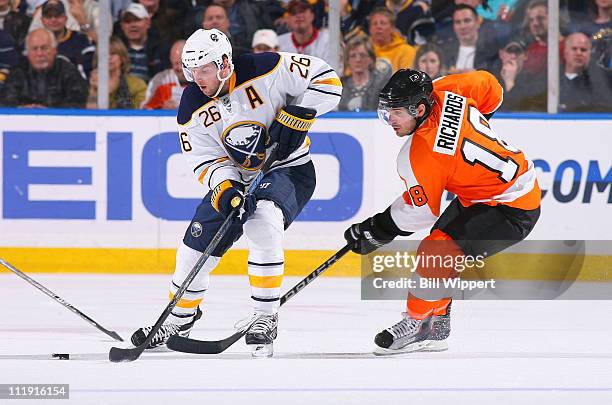 Thomas Vanek of the Buffalo Sabres controls the puck in front of Mike Richards of the Philadelphia Flyers at HSBC Arena on March 8, 2011 in Buffalo,...