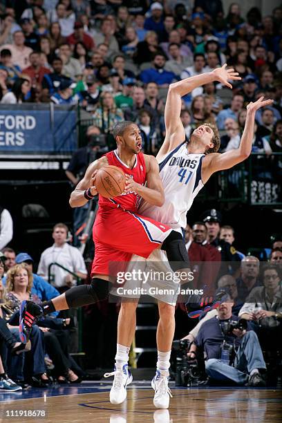 Eric Gordon of the Los Angeles Clippers looks to pass against Dirk Nowitzki of the Dallas Mavericks during the game on April 8, 2011 at the American...