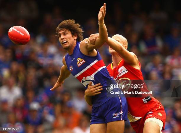 Ryan Griffen of the Bulldogs is tackled by Gary Ablett of the Suns during the round three AFL match between the Western Bulldogs and the Gold Coast...