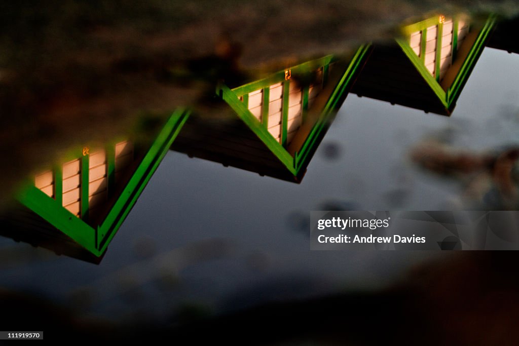 Beach Huts and Puddles