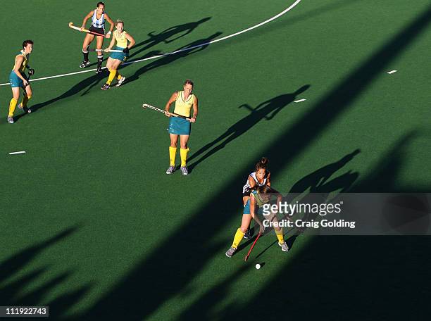 Kate Jenner of the Hockeyroos and Rocio Sanchez Moccia of Argentina compete for the ball during game four of the International Test Series between...