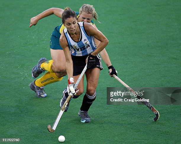 Jade Warrender of the Hockeyroos and Ana Macarena Rodriguez Perez of Argentina compete for the ball during game four of the International Test Series...