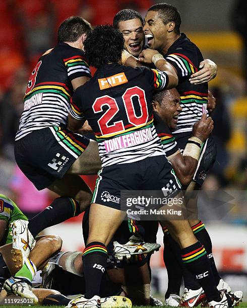 Petero Civoniceva of the Panthers celebrates with Michael Jennings and Timana Tahu after scoring a try in the final seconds during the round five NRL...