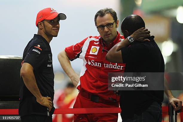 Lewis Hamilton of Great Britain and McLaren and his father Anthony Hamilton talk with Ferrari Team Principal Stefano Domenicali outside the McLaren...