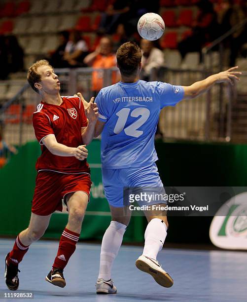 Player of Holzpfosten Schwerte and a player of VfR Ittersbach battle for the ball during the 3rd place match of the DFB Futsal Cup at ring arena on...