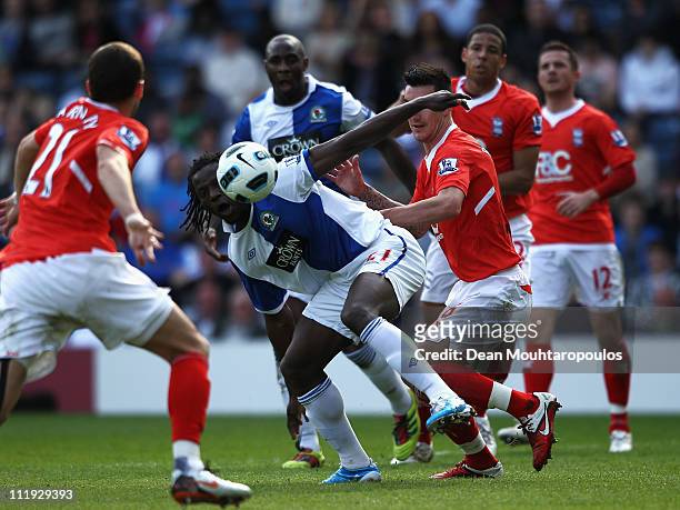 Benjani of Blackburn battles for the ball with Liam Ridgwell of Birmingham City during the Barclays Premier League match between Blackburn Rovers and...