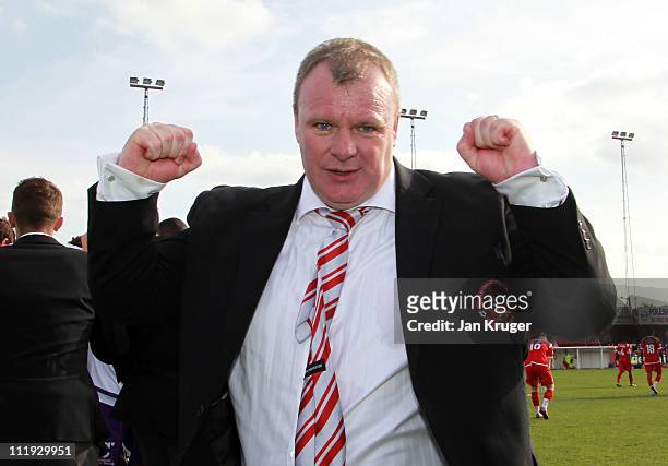 Steve Evans, Manager of Crawley Town punches the air at the final whistle after a win that secures promotion during the Blue Square Bet Premier...