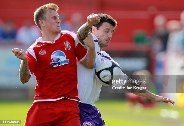 Craig McAllister of Crawley Town battles with Richard Tait of Tamworth during the Blue Square Bet Premier League match between Tamworth and Crawley...