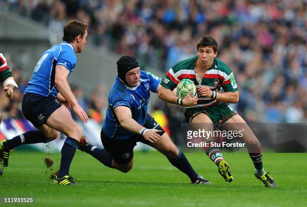 Tigers scrum half Ben Youngs speeds past Mike Ross of Leinster during the Heineken Cup Quarter Final match between Leinster and Leicester Tigers at...