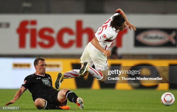 Erwin Hoffer of Kaiserslautern fouls Christian Traesch of Stuttgart during the Bundesliga match between VfB Stuttgart and 1. FC Kaiserslautern at the...