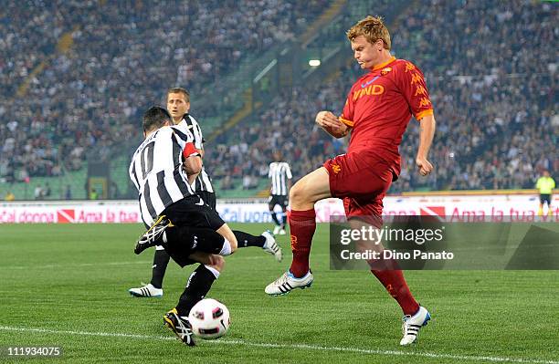 Antonio Di Natale of Udinese competes with John Arne Riise of Roma during the Serie A match between Udinese Calcio and AS Roma at Stadio Friuli on...