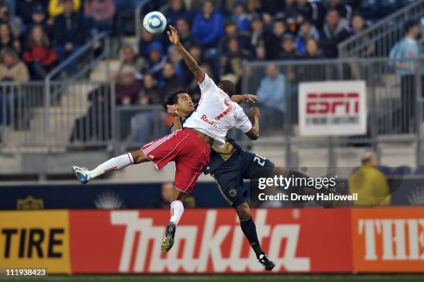 Carlos Ruiz of the Philadelphia Union and Roy Miller of the New York Red Bulls collide going for the ball at PPL Park on April 9, 2011 in Chester,...