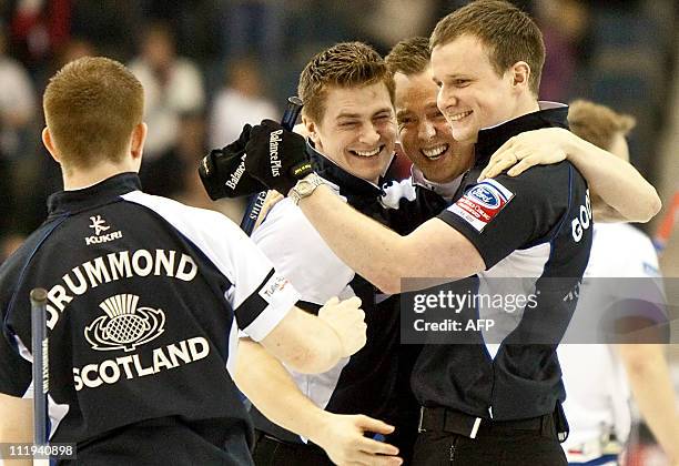 The Scottish team celebrate 7-6 win in their semi-final against Norway at the Ford World Men's Curling Championships in Regina, Saskatchewan, April...