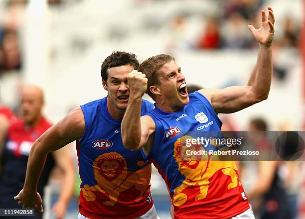 Luke Power of the Lions celebrates kicking a goal during the round three AFL match between the Melbourne Demons and the Brisbane Lions at Melbourne...