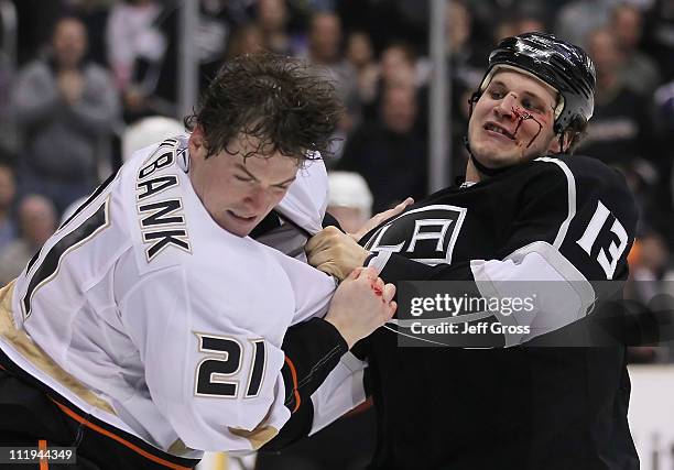 Kyle Clifford of the Los Angeles Kings throws a punch at Sheldon Brookbank of the Anaheim Ducks in the third period at Staples Center on April 9,...