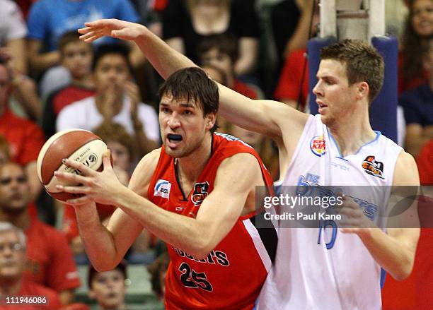 Thomas Abercrombie of the Breakers holds out Jeremiah Trueman of the Wildcats during game two of the NBL Semi Final series between the New Zealand...