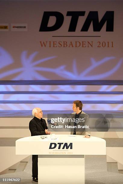 Primary Chairman of the DTM Hans Werner Aufrecht speaks to ARD Anchorman Claus Lufen at the press conference on April 10, 2011 in Wiesbaden, Germany.