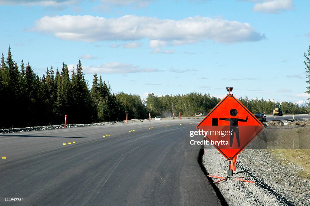 Red slow done Signpost on the highway