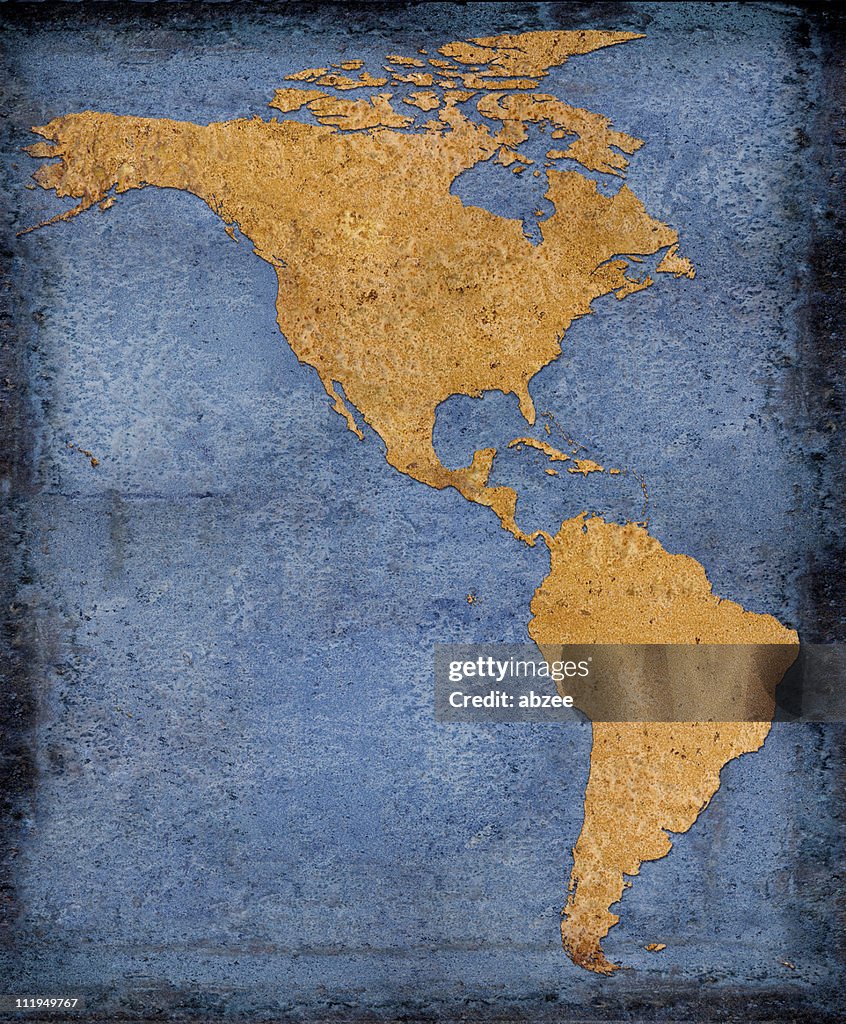 Rusty North and South America on blue background