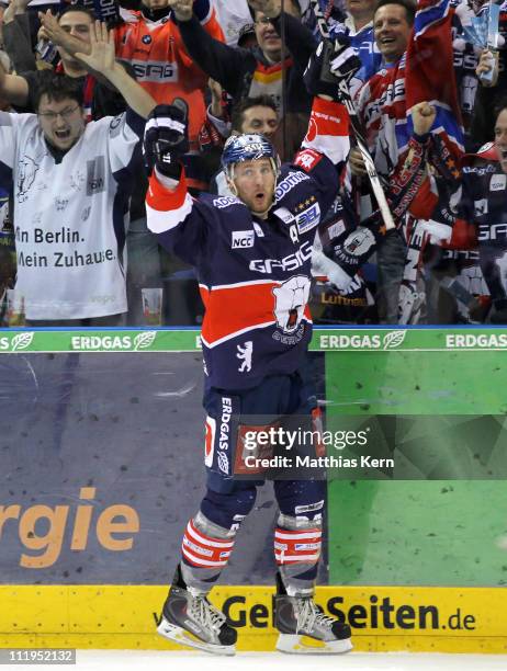 Andre Rankel of Berlin jubilates after scoring the first goal during the fourth DEL play off semi final match between EHC Eisbaeren Berlin and DEG...