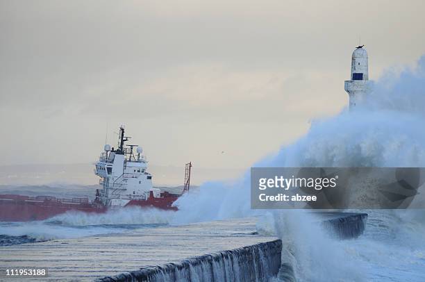 supply boat leaving aberdeen on a stormy day - grampian scotland stock pictures, royalty-free photos & images