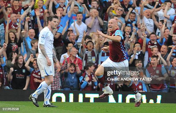 Aston Villa's Welsh defender James Collins celebrates after scoring the opening goal during the English Premier League football match between Aston...