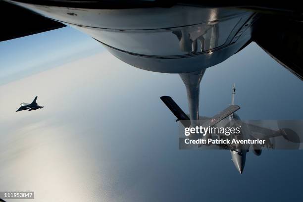 French air force Rafale fighter jet refuels with a Boeing C.135 refuelling tanker over the Mediterranean sea during the air operation "Harmattan",...