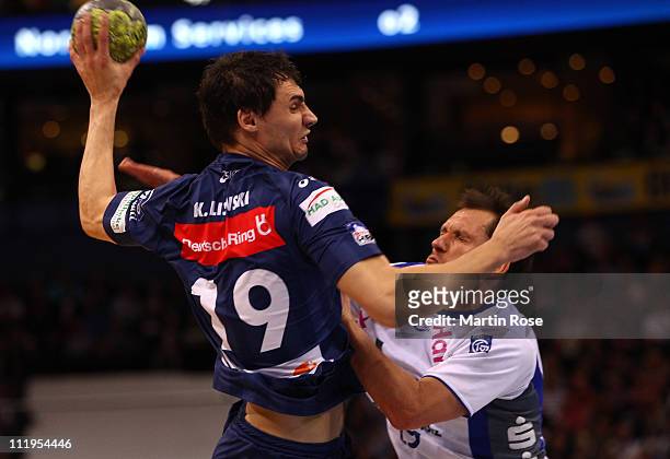 Krysztof Lijewski of Hamburg is challenged by Andreas Kunz of Grosswallstadt during the Toyota Handball Bundesliga match between HSV Hamburg and TV...