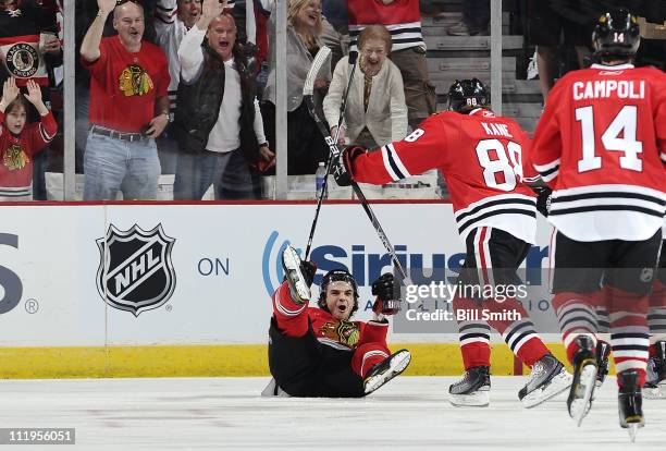 Michael Frolik of the Chicago Blackhawks reacts after scoring the first goal of the game against the Detroit Red Wings on April 10, 2011 at the...