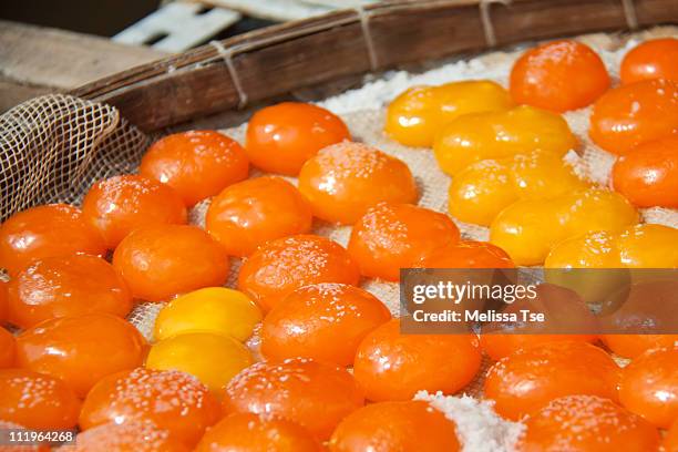 salted egg yolk sun drying in tai o, hong kong - gezout stockfoto's en -beelden