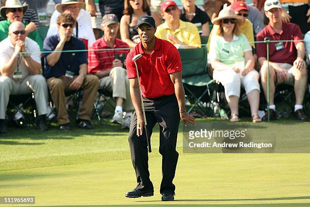 Tiger Woods reacts to missing his putt on the 16th hole during the final round of the 2011 Masters Tournament at Augusta National Golf Club on April...