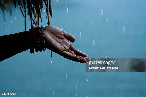 celebrating the rain - enjoy monsoon stock-fotos und bilder