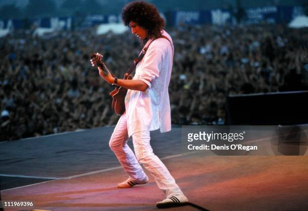 Guitarist Brian May performing with British rock group, Queen, at the Nepstadion, Budapest, during the Magic Tour, 27th July 1986.