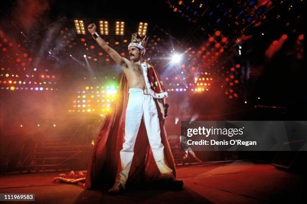 Singer Freddie Mercury performing with British rock group Queen at Wembley Stadium, London, during the Magic Tour, July 1986. The band played two...