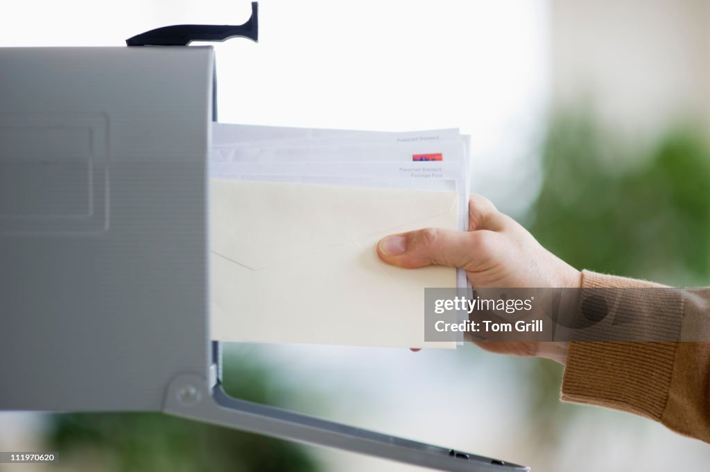 Pulling mail out of mailbox