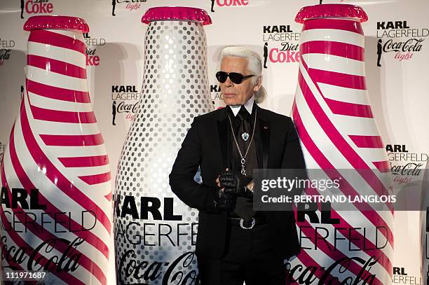 German fashion designer and photographer Karl Lagerfeld poses during the launch party of Coke diet in Paris on April 7, 2011. AFP PHOTO BERTRAND...