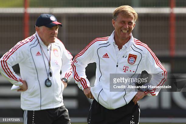 Andries Jonker , head coach of Bayern Muenchen smiles with his assistent coach Hermann Gerland during the Bayern Muenchen training session at...