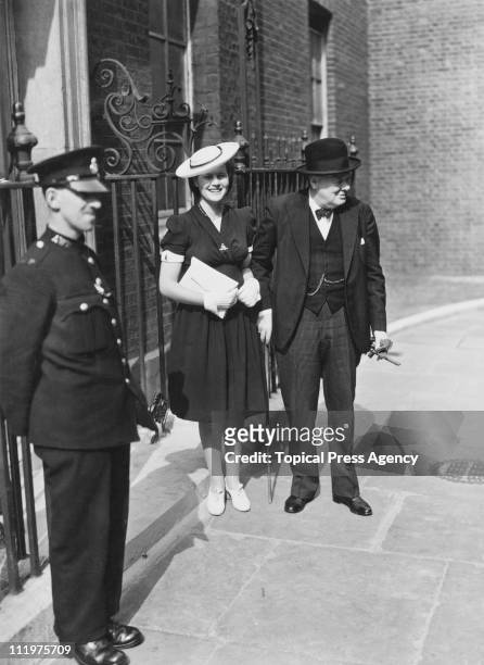 British Prime Minister Winston Churchill with his youngest daughter Mary Spencer-Churchill , outside 10 Downing Street, London 3rd July 1942.