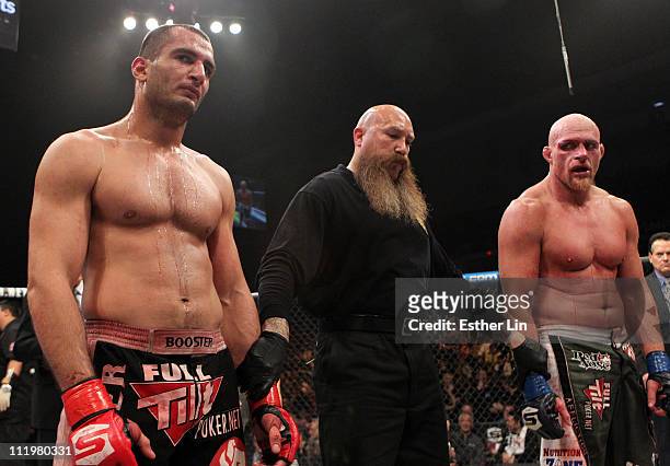 Both Gegard Mousasi and Keith Jardine are dejected as the decision is announced as a draw after their light heavyweight bout at the Strikeforce event...