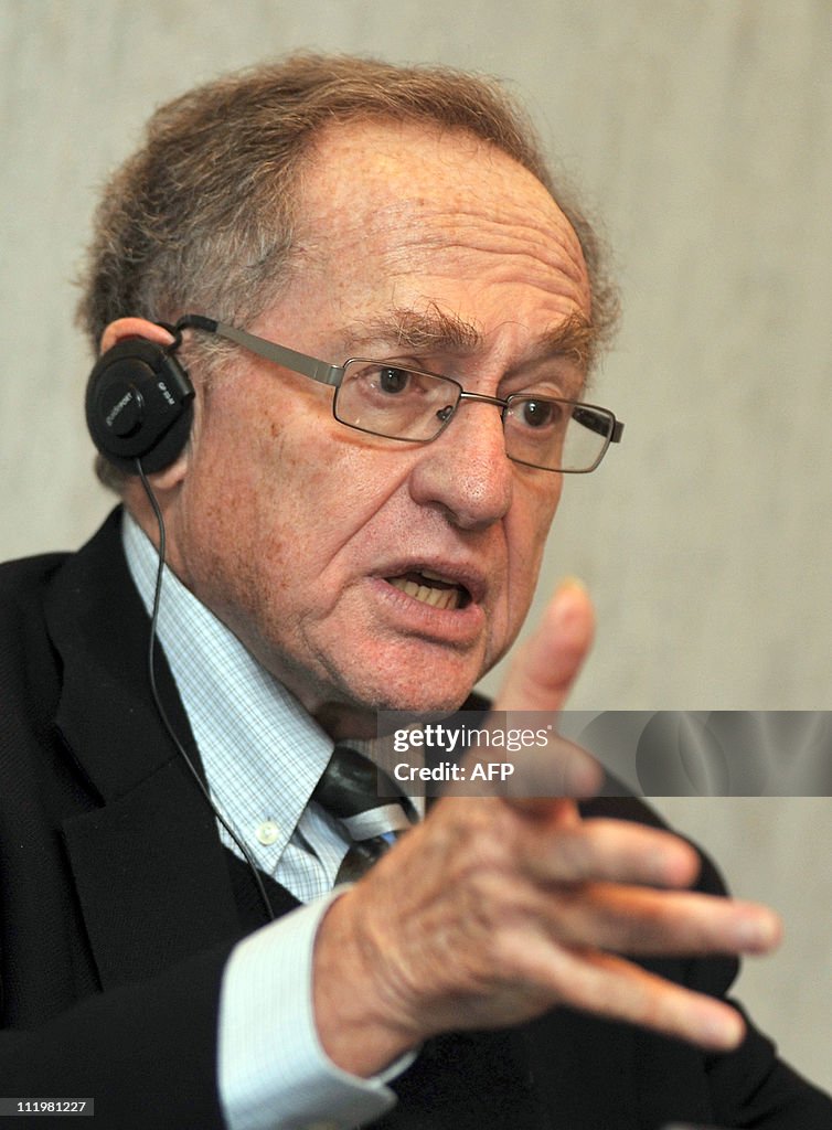 Alan Dershowitz gestures during his pres