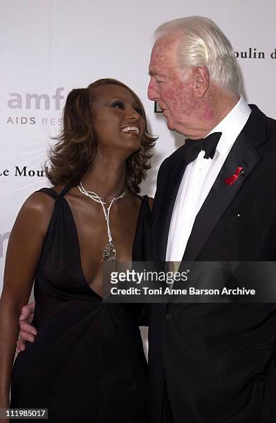 Iman & Hubert de Givenchy during Cannes 2002 - amfAR's Cinema Against AIDS Gala sponsored by Motorola and co-sponsored by De Beers - Arrivals at Le...