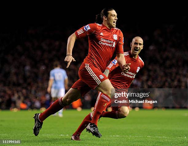 Andy Carroll of Liverpool celebrates scoring the opening goal with team mate Raul Meireles during the Barclays Premier League match between Liverpool...